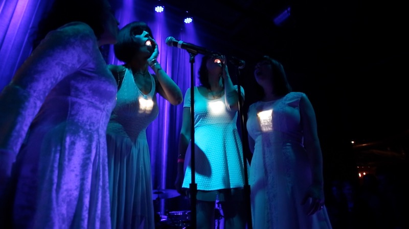 Dessa and some other singers showing off their custom wearables (Ricardo Zapata).