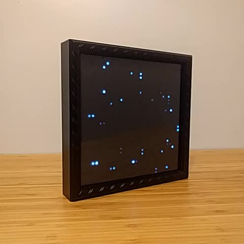 An LED starfield inside a picture frame.
